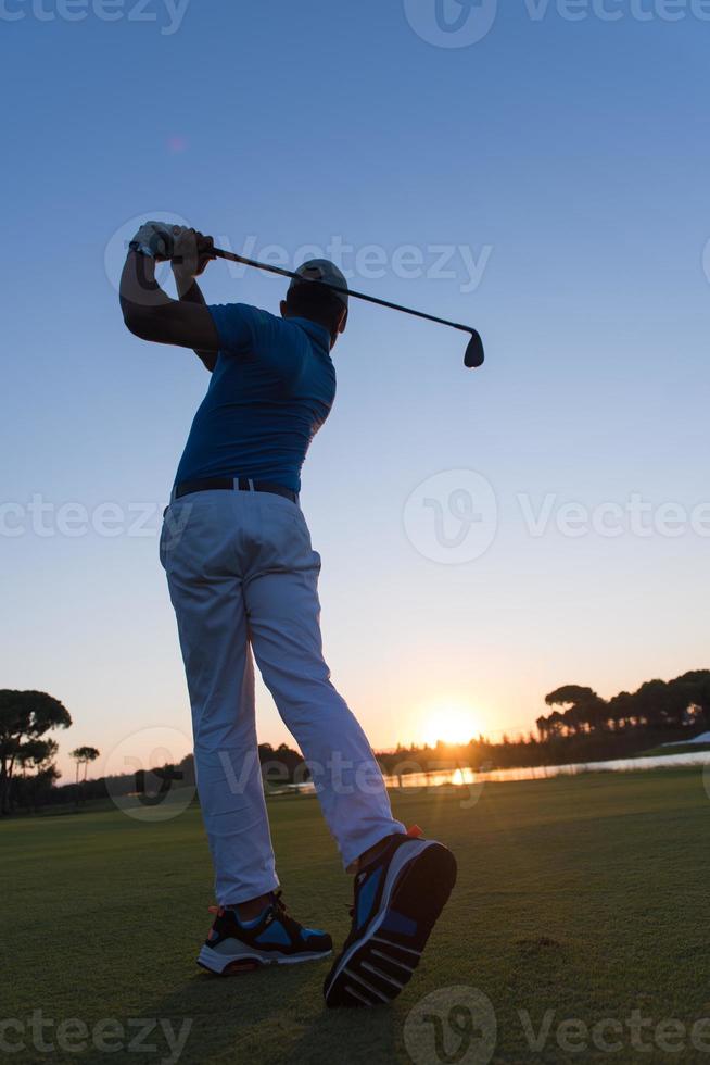 golfer hitting long shot photo