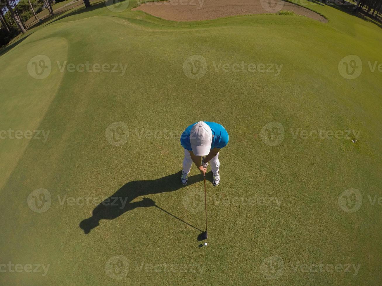 top view of golf player hitting shot photo