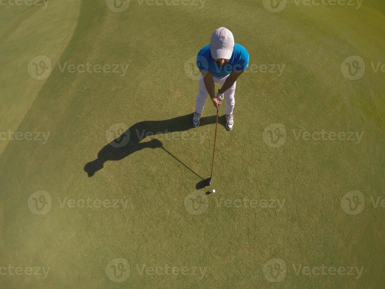 top view of golf player hitting shot photo