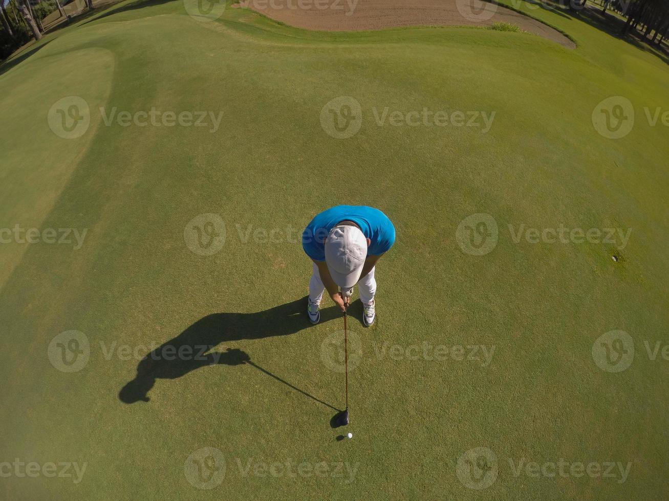 top view of golf player hitting shot photo