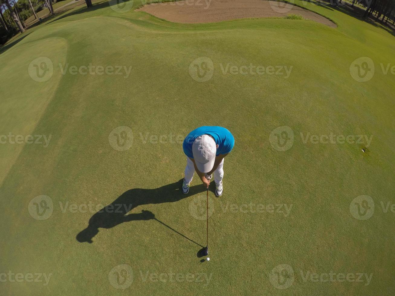 top view of golf player hitting shot photo