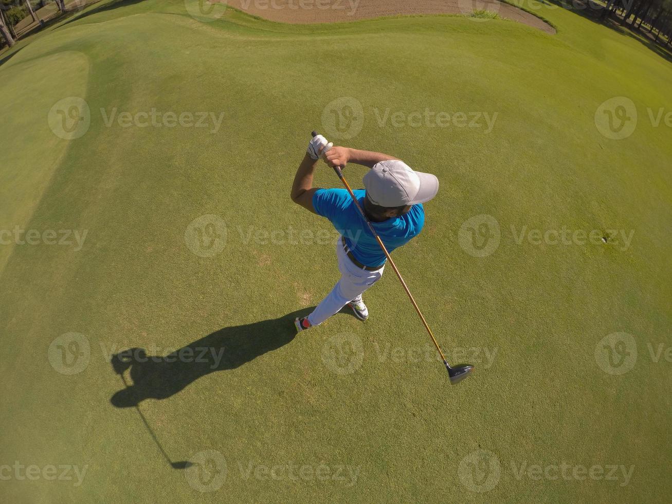 top view of golf player hitting shot photo