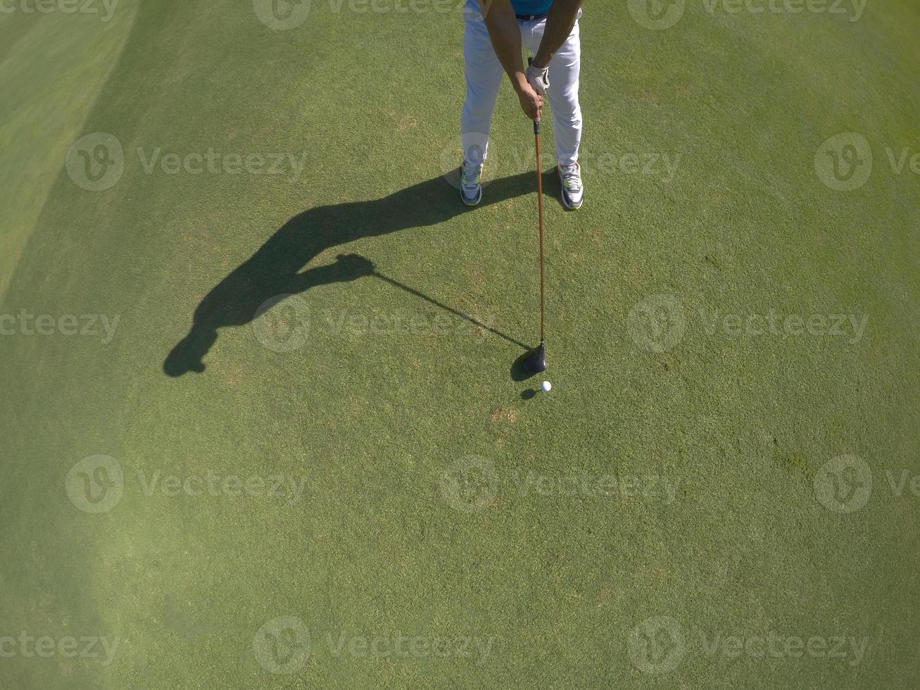 top view of golf player hitting shot photo