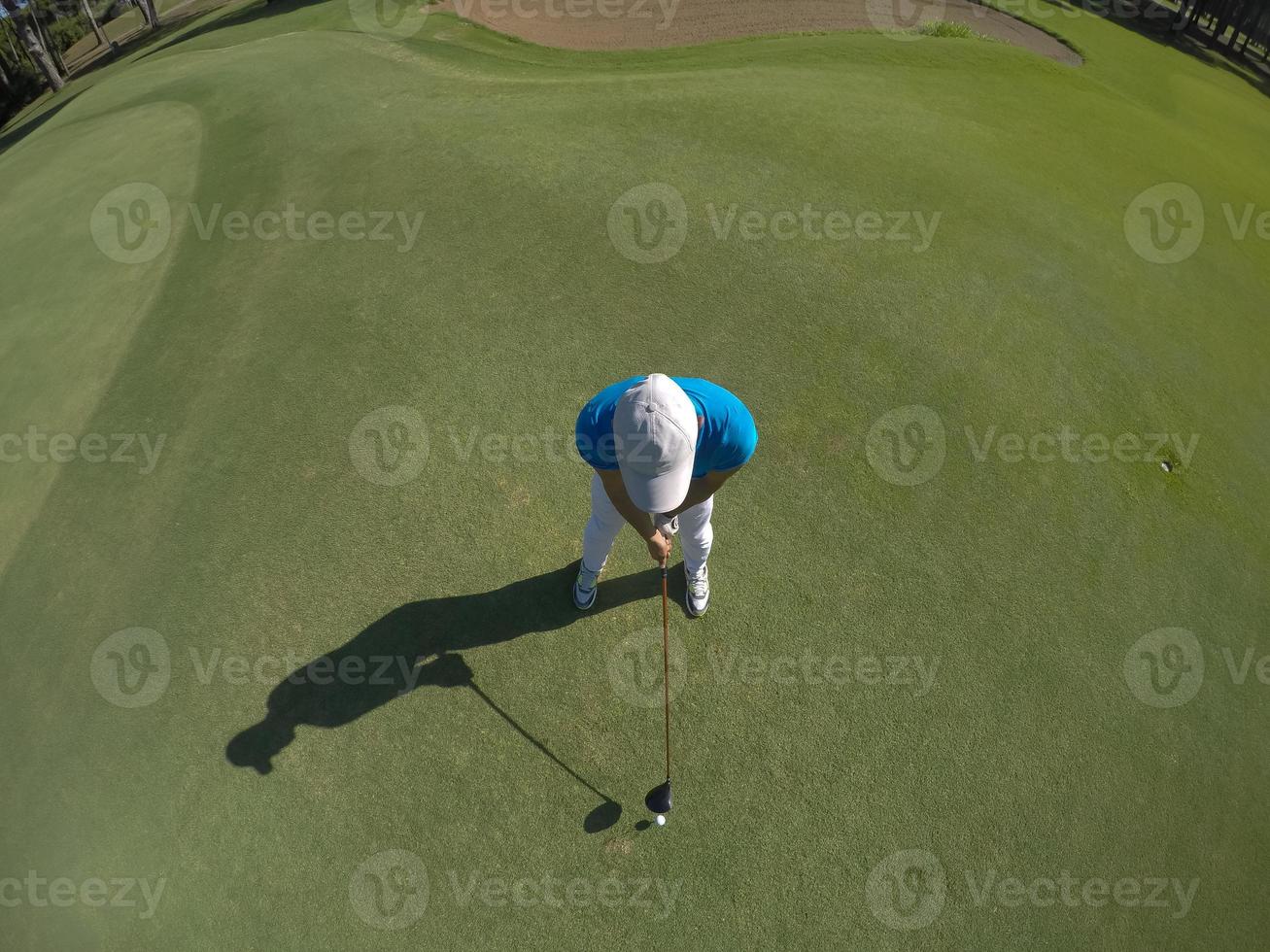 top view of golf player hitting shot photo