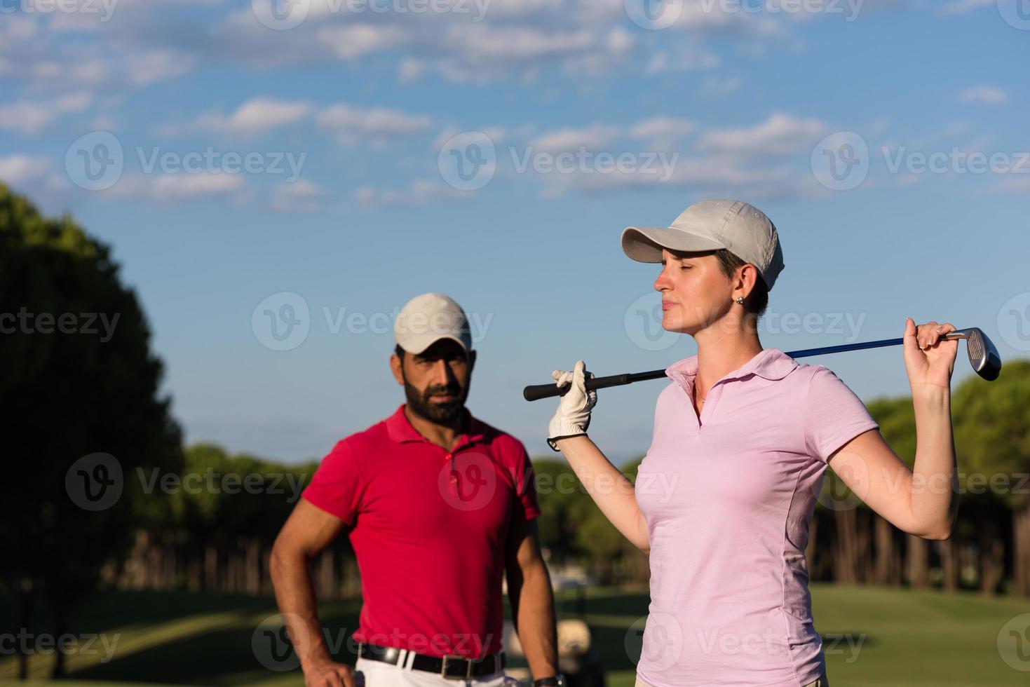 portrait of couple on golf course photo
