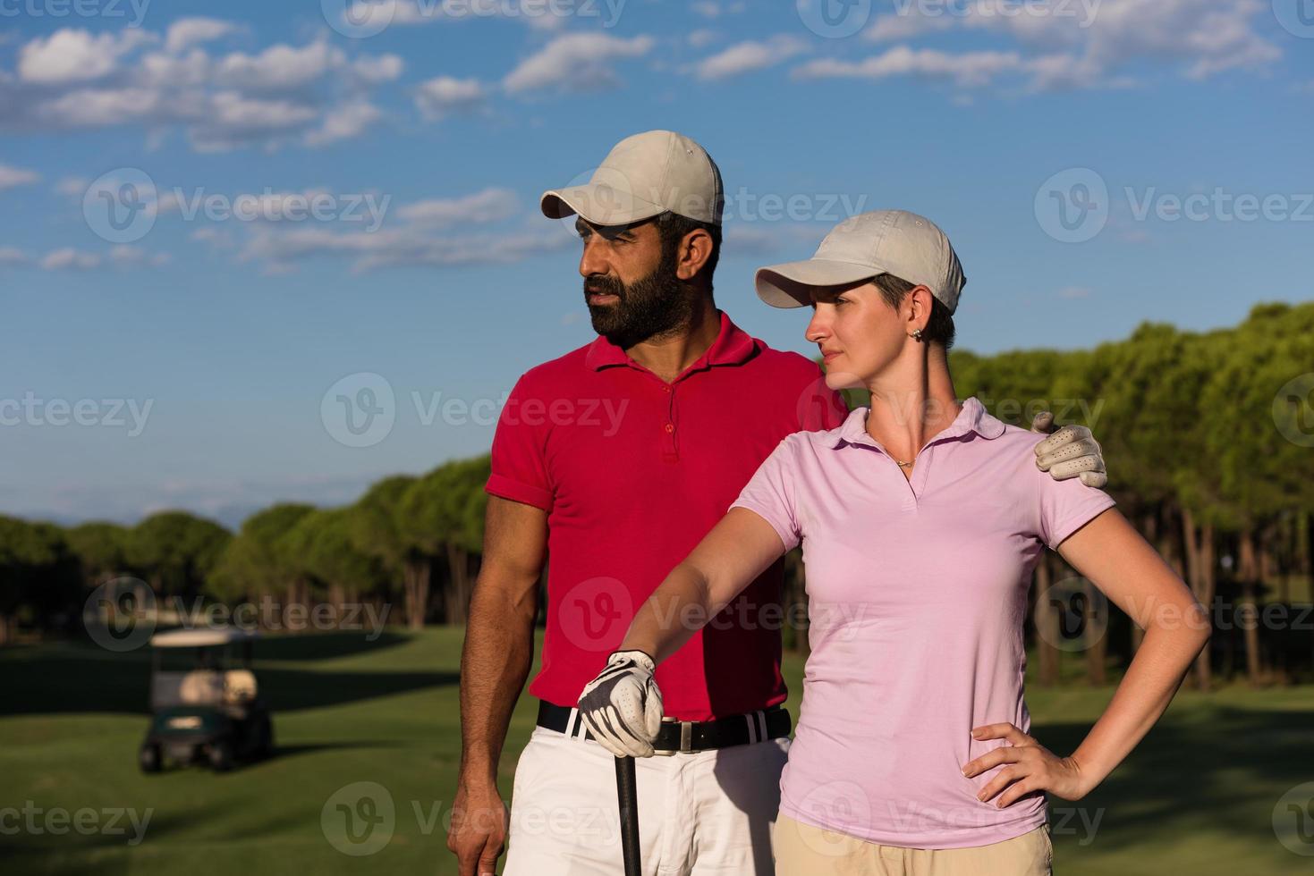 portrait of couple on golf course photo