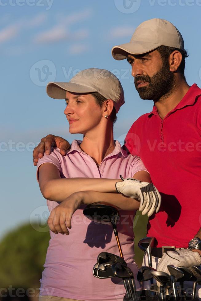 portrait of couple on golf course photo