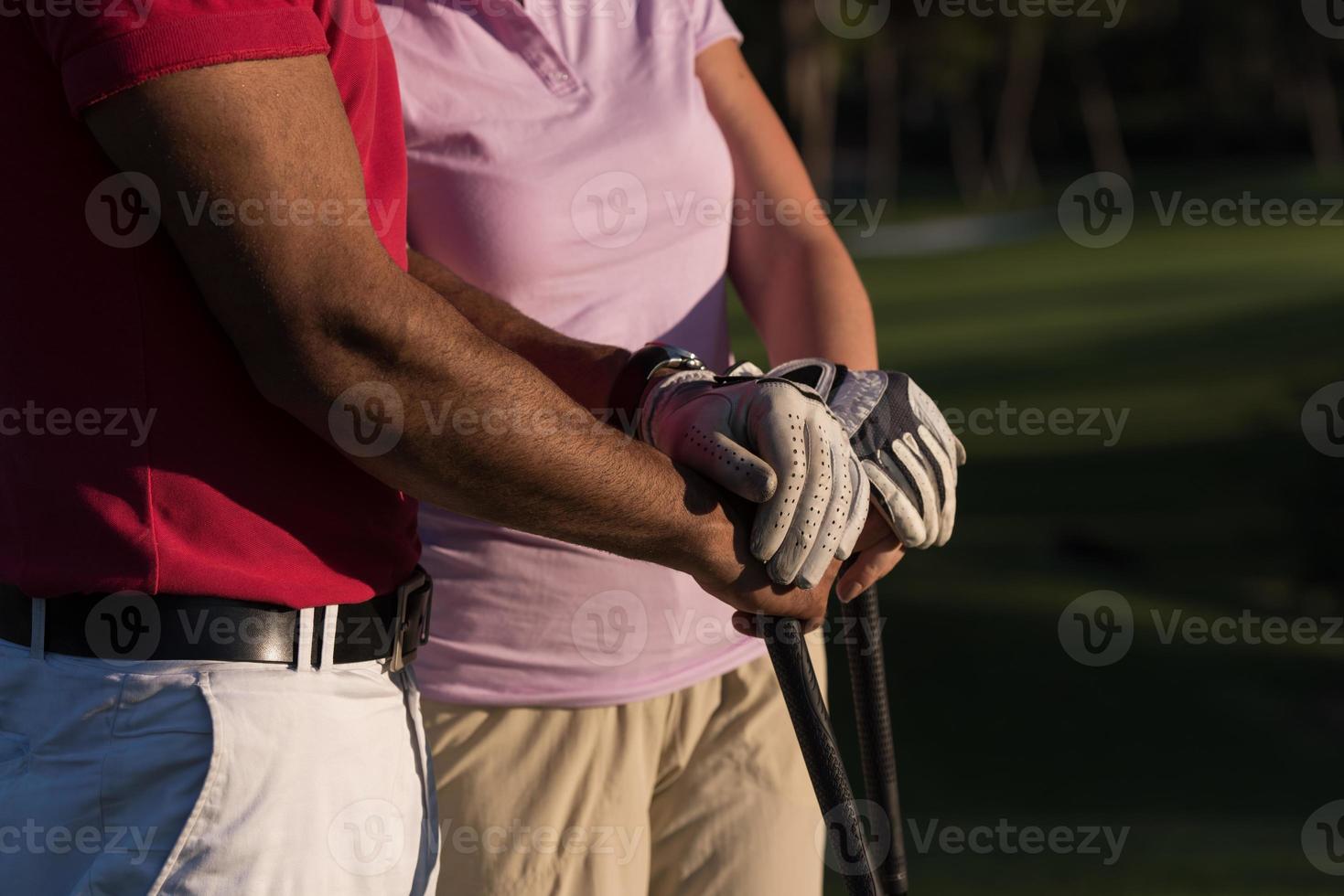 portrait of couple on golf course photo
