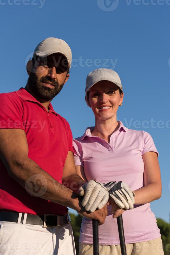 portrait of couple on golf course photo