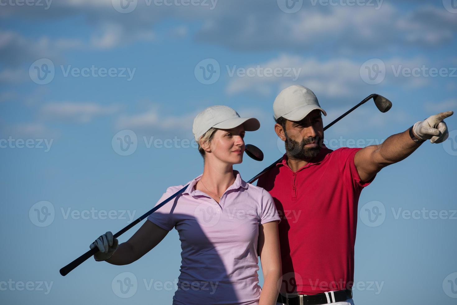 portrait of couple on golf course photo