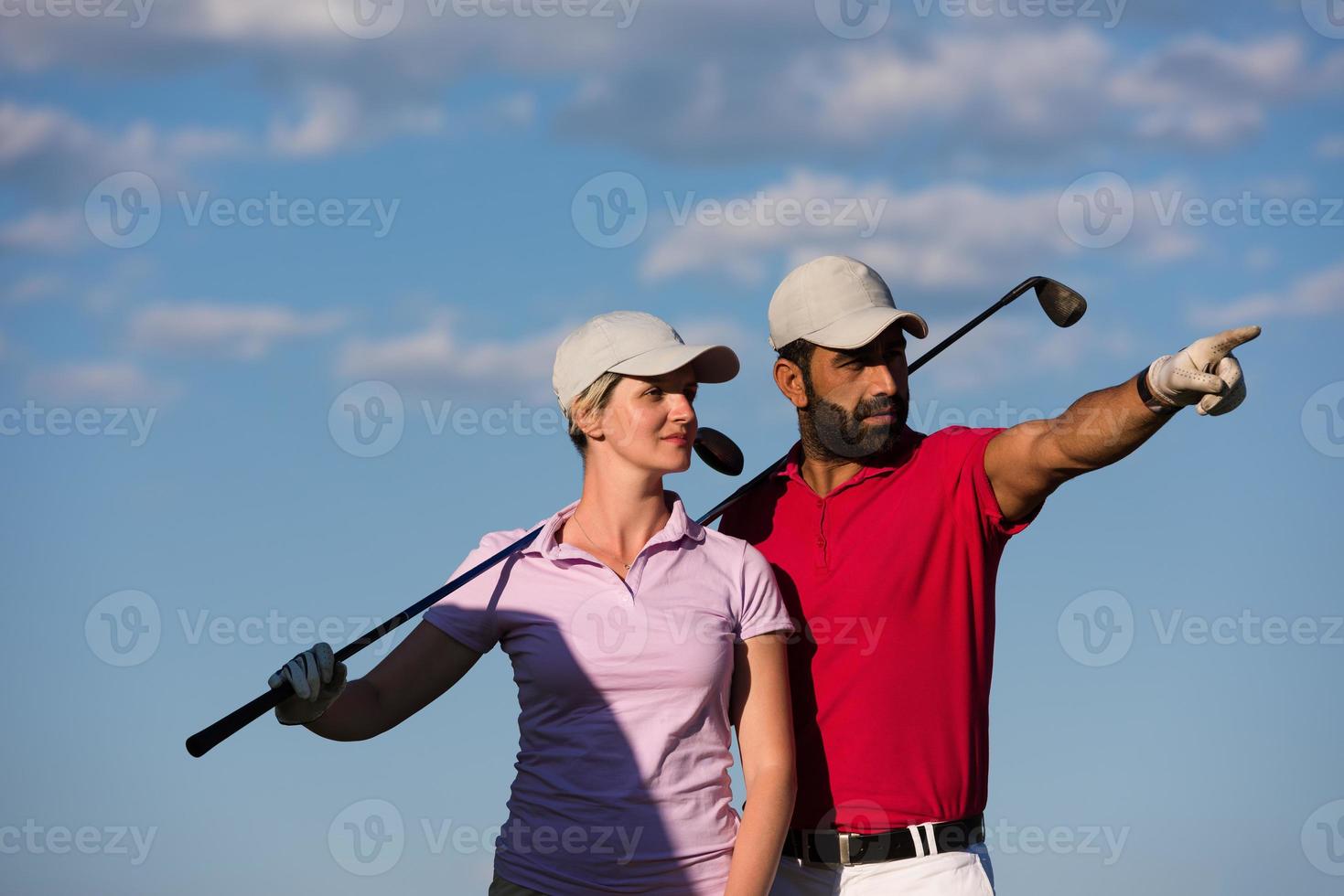 portrait of couple on golf course photo