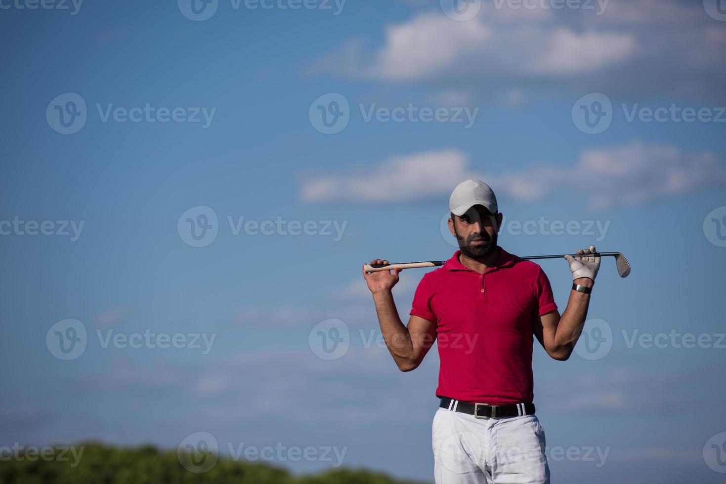 handsome middle eastern golf player portrait at course photo