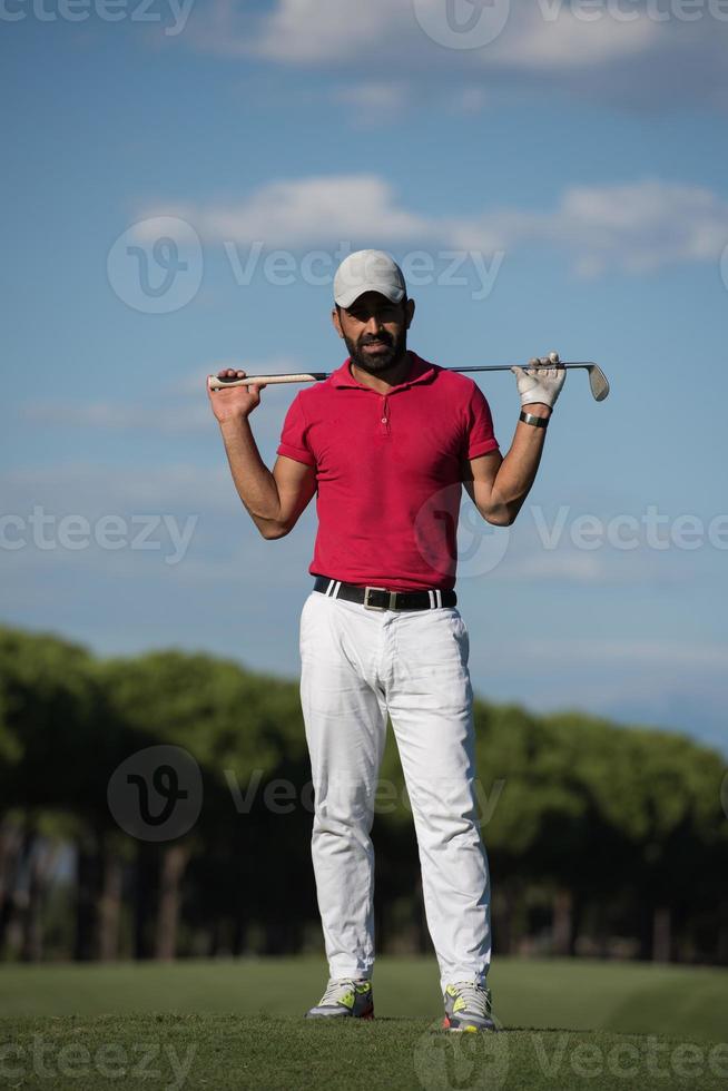 handsome middle eastern golf player portrait at course photo