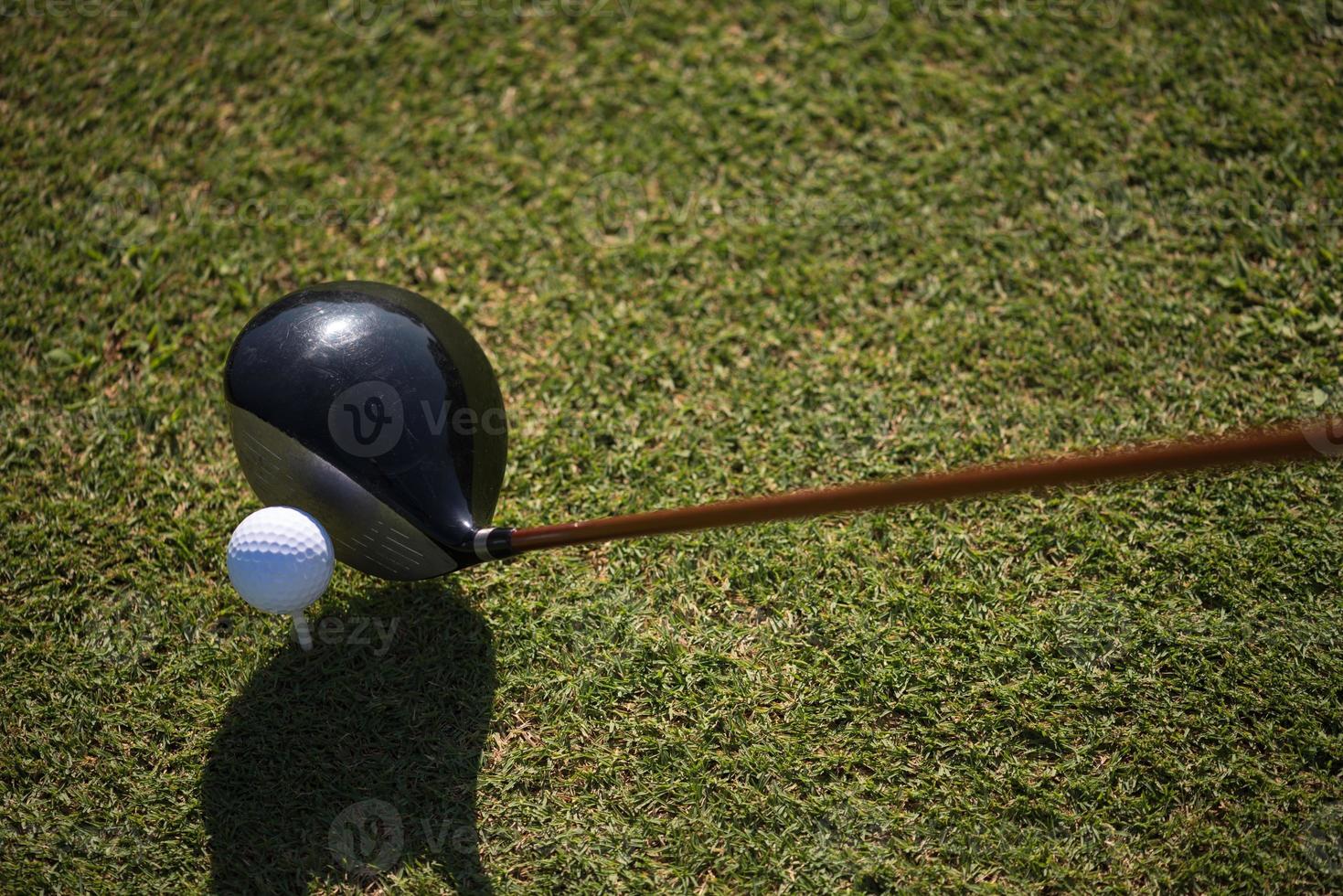 golf club and ball in grass photo