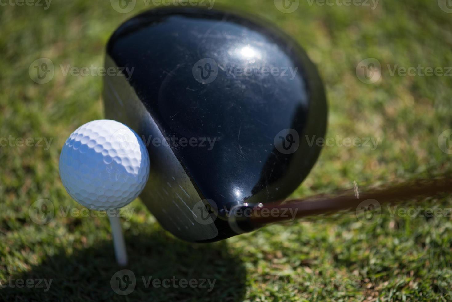 top view of golf club and ball in grass photo