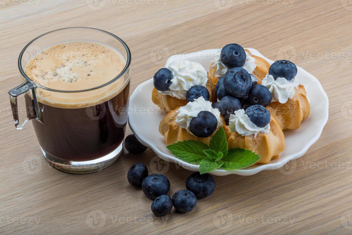 Profiterole with blueberry photo