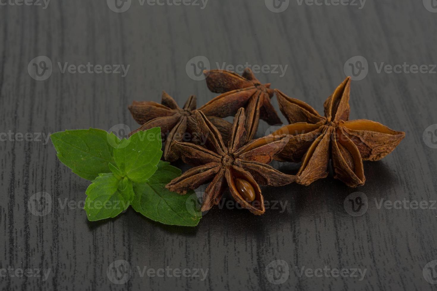 Star anise on wooden background photo