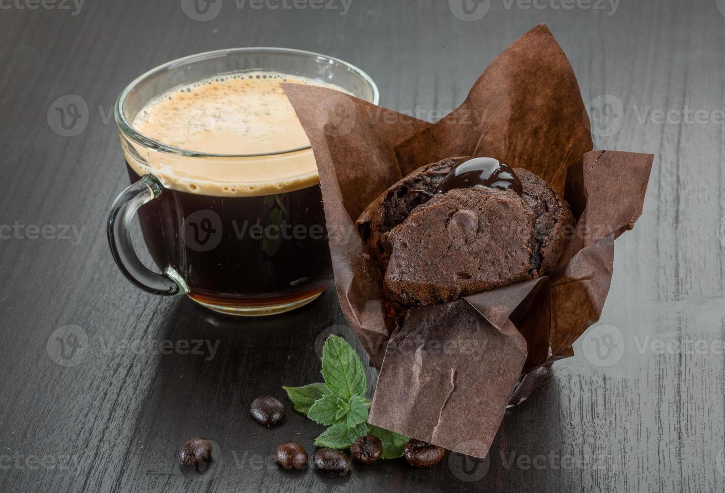 Coffee with muffin on wooden background photo