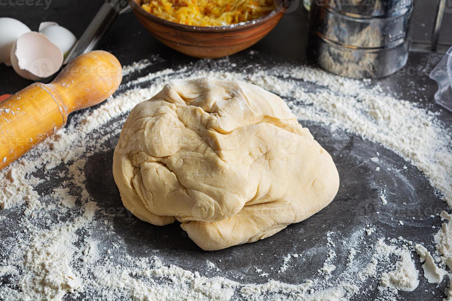 Homemade making dough of pizza, pierogi. Preparation dough for cooking photo