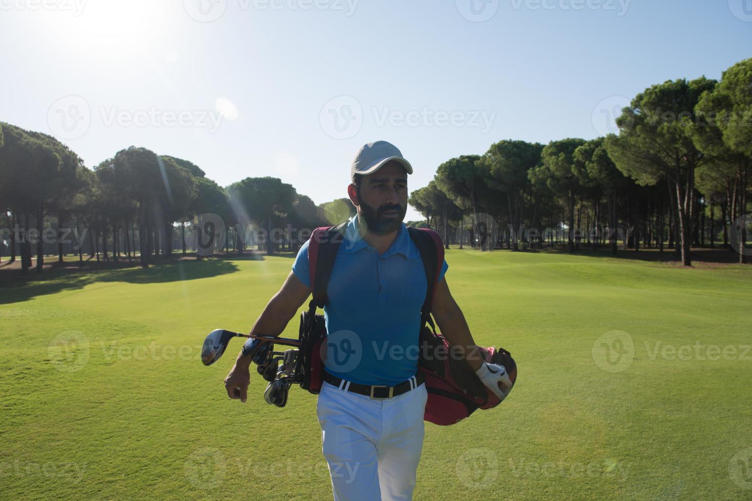 golf player walking photo