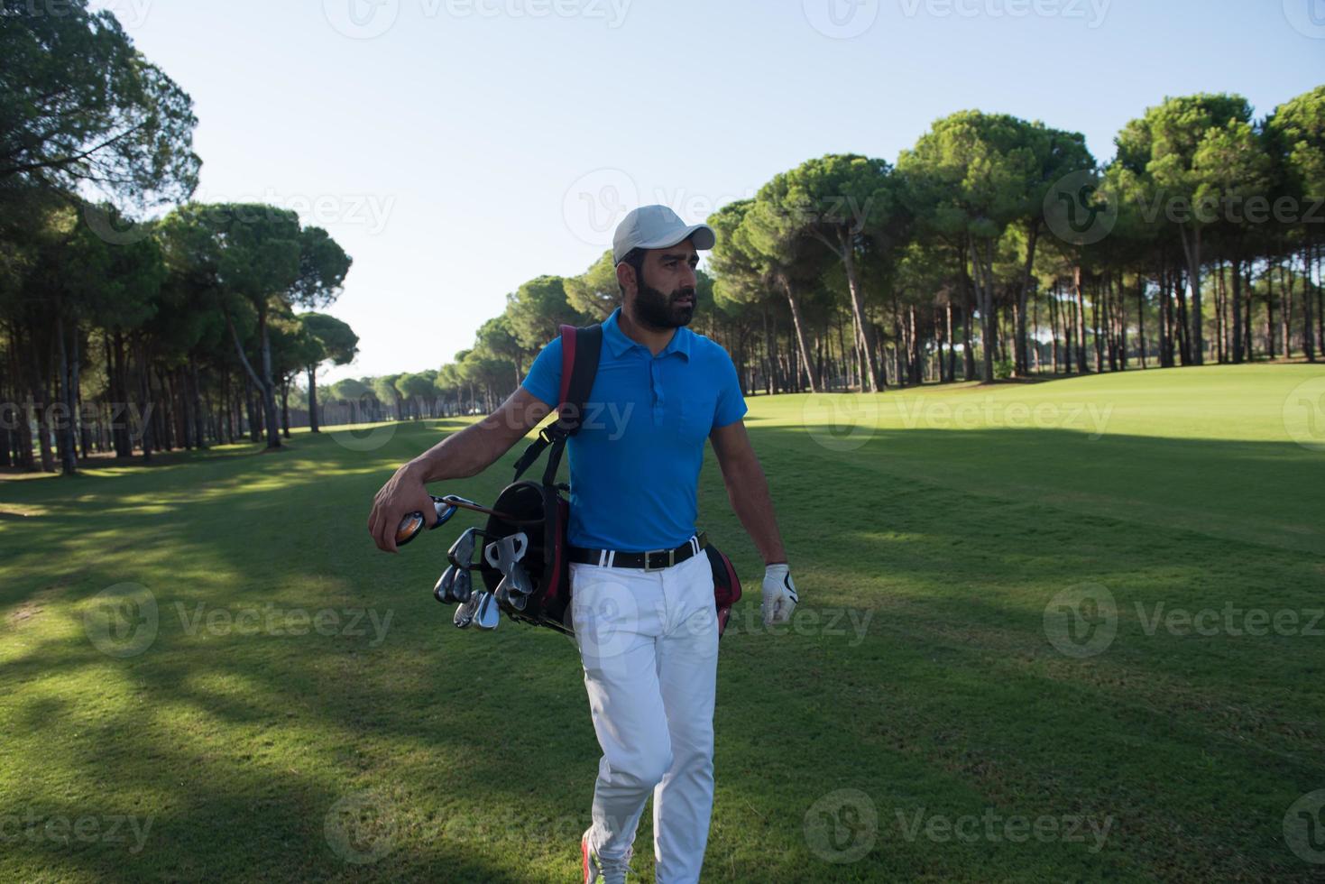 golf player walking photo