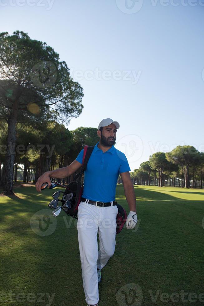 golf player walking photo