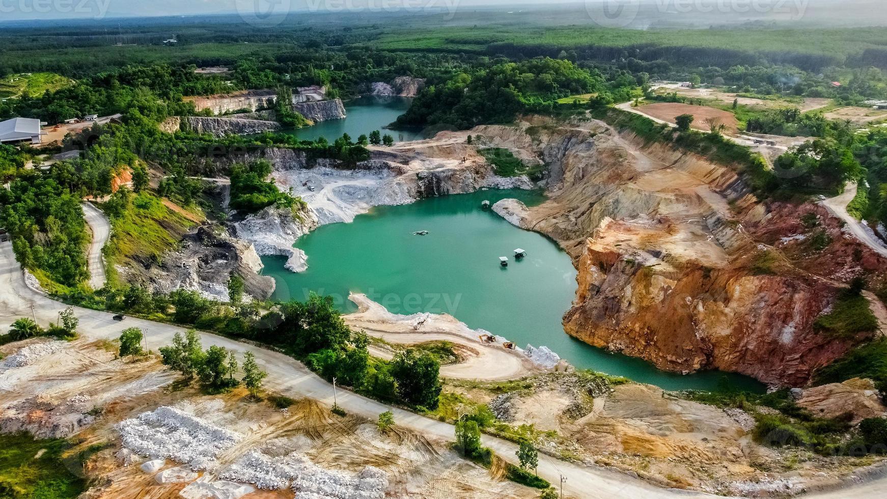 A large hole formed by mining, the view is quaint and beautiful. mining industry concept photo