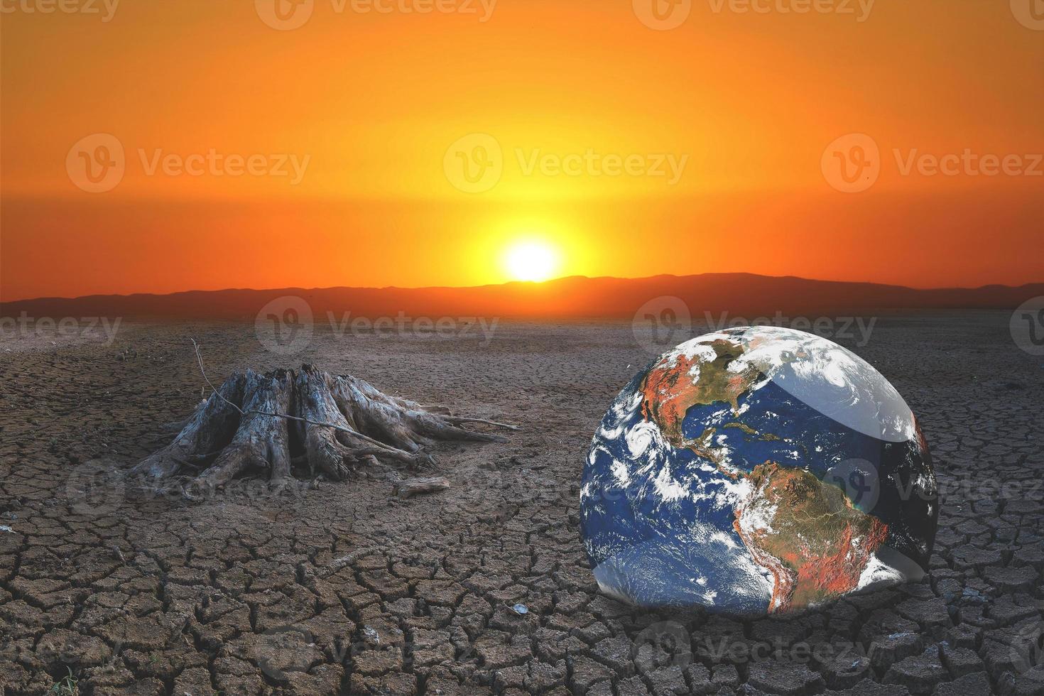 The concept of global warming and drought and poverty and food shortages. Arid soils with hot climates have a globe that lacks green space. photo
