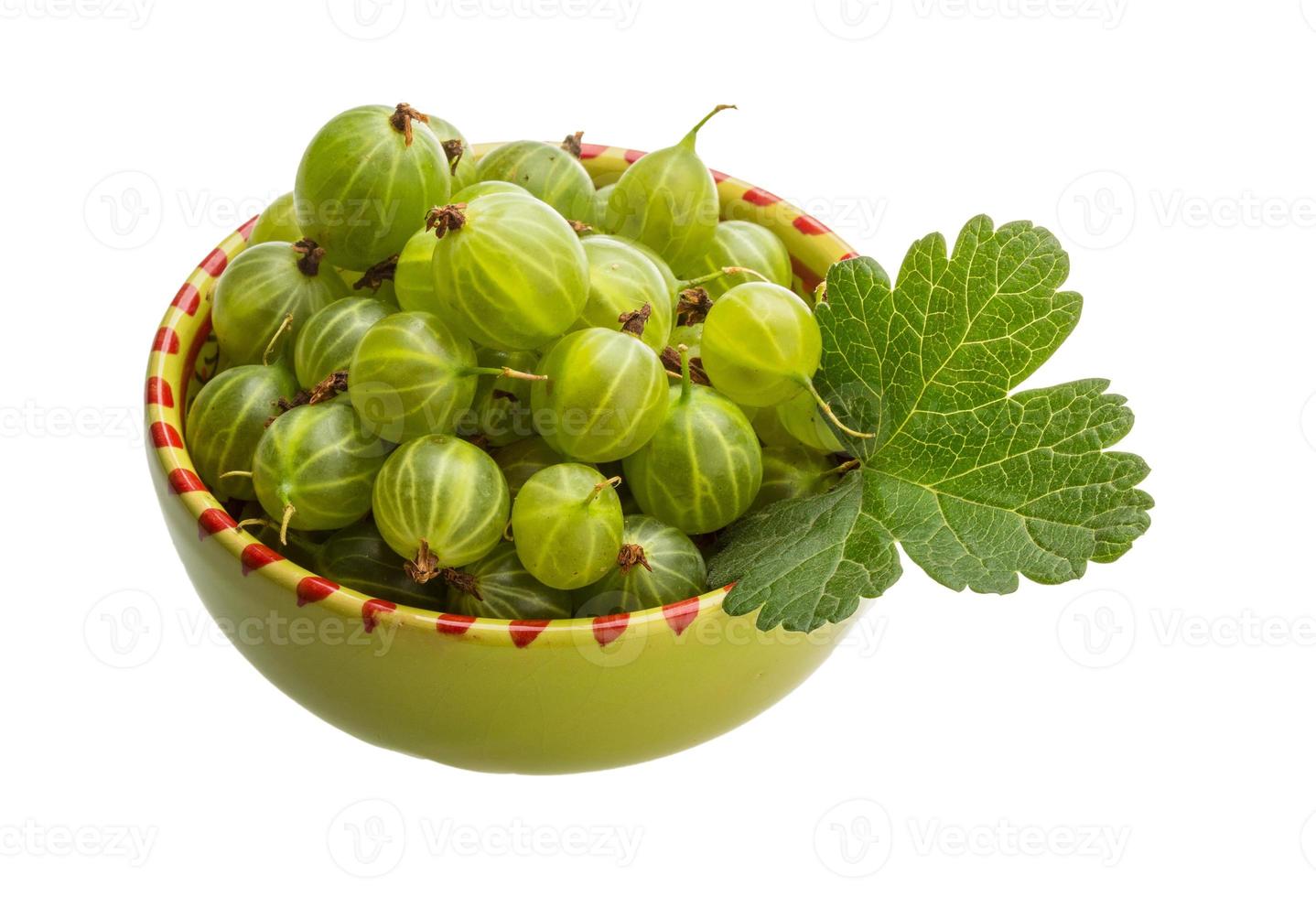 Gooseberry in a bowl on white background photo