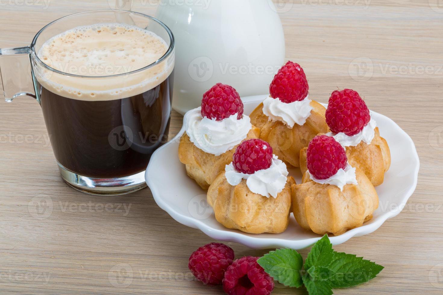 Profiterole with raspberry photo