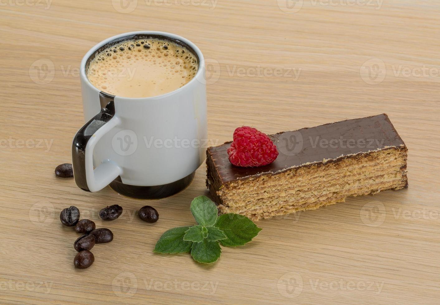 Coffee with cake on wooden background photo