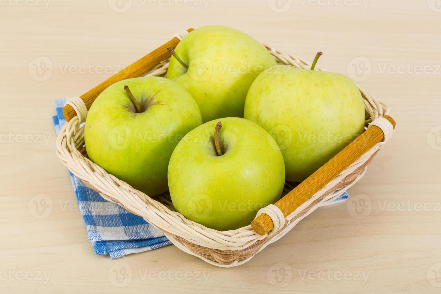Green apple in a bowl photo
