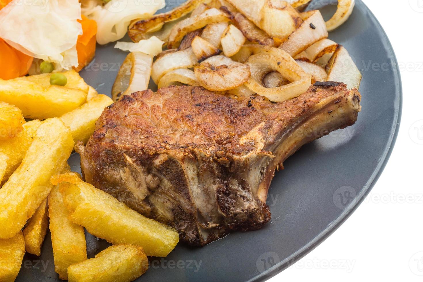 T-bone steak on the plate and white background photo