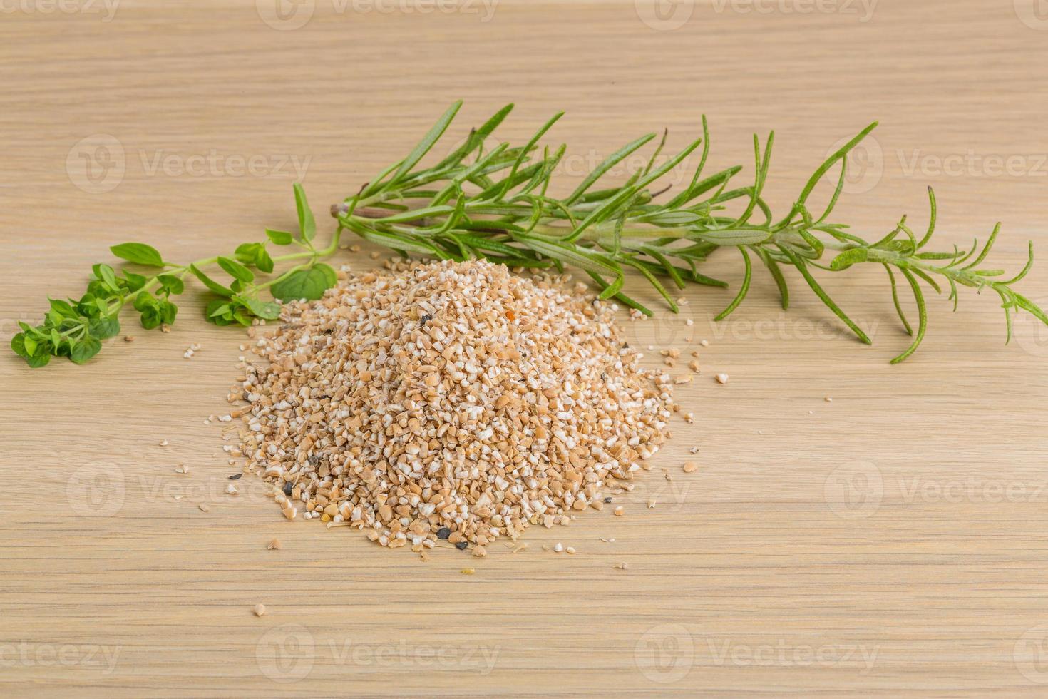 Crusted Pearl Barley on wooden background photo