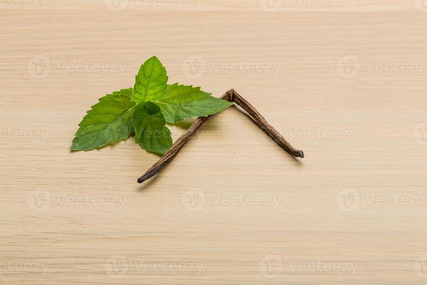 Vanilla on wooden background photo