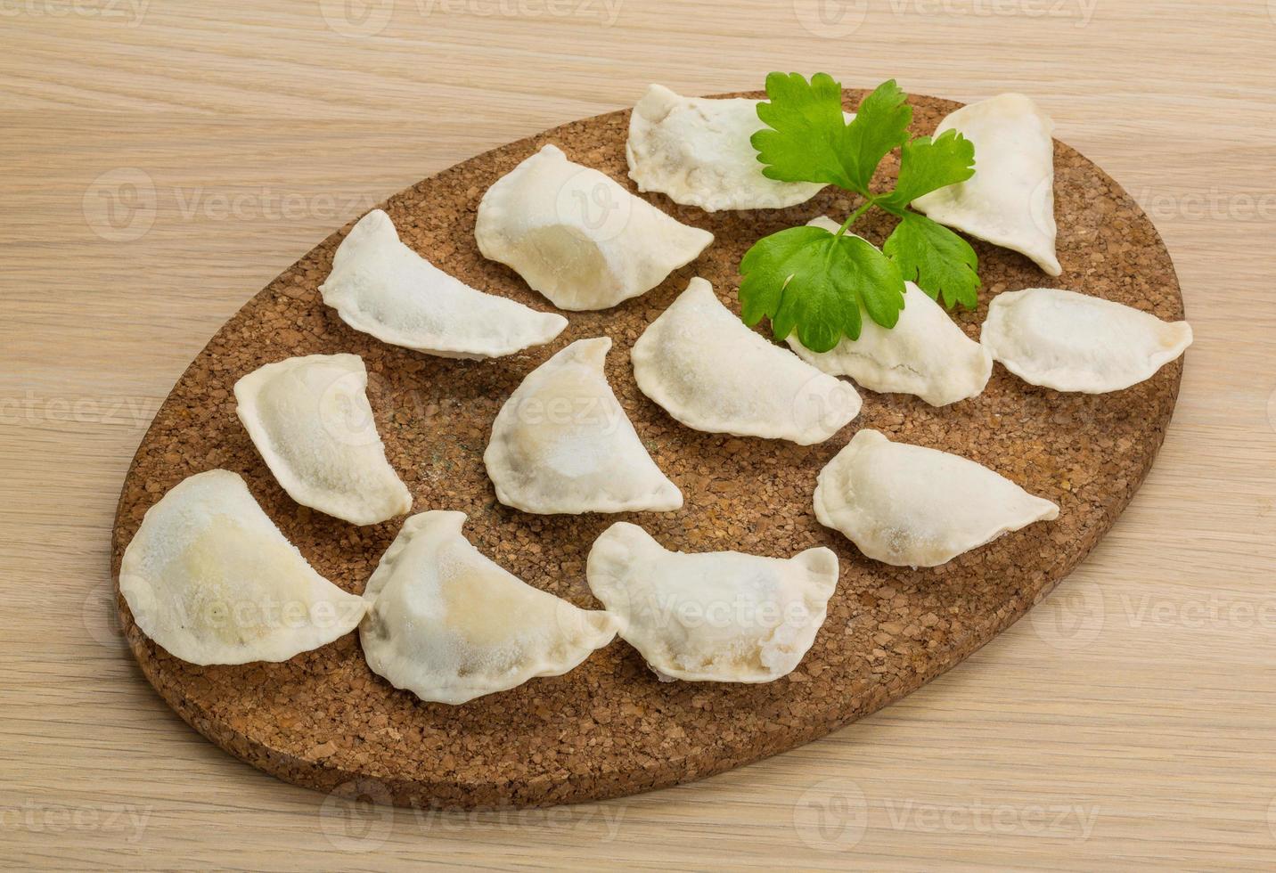 Ukrainian vareniki on wooden background 10864264 Stock Photo at Vecteezy