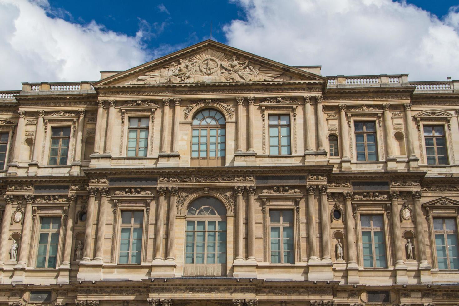 PARIS - JUNE 7 - Louvre building on June 7, 2012 in Louvre Museum, Paris, France. With 8.5m annual visitors, Louvre is consistently the most visited museum worldwide. photo