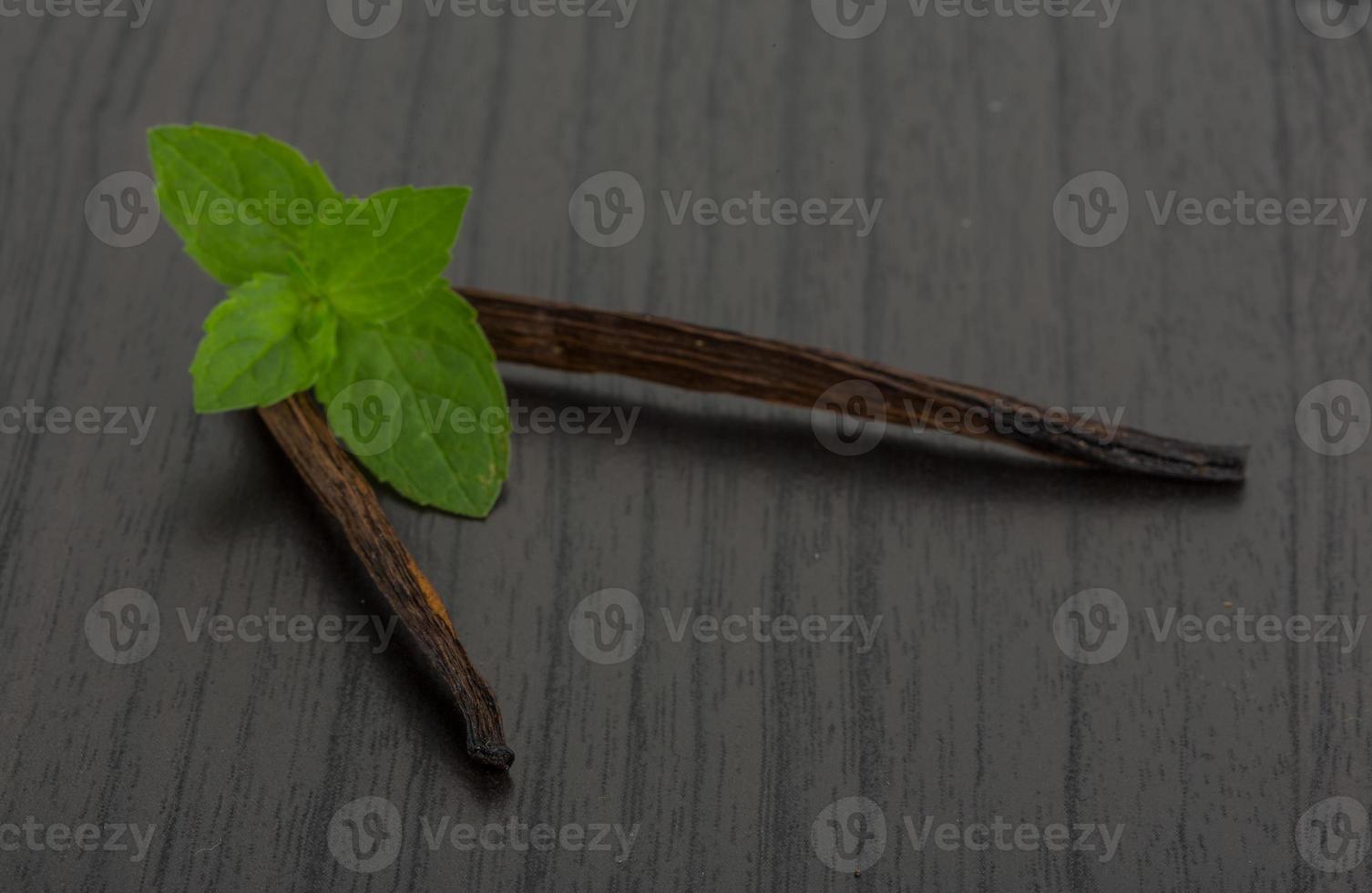 Vanilla on wooden background photo
