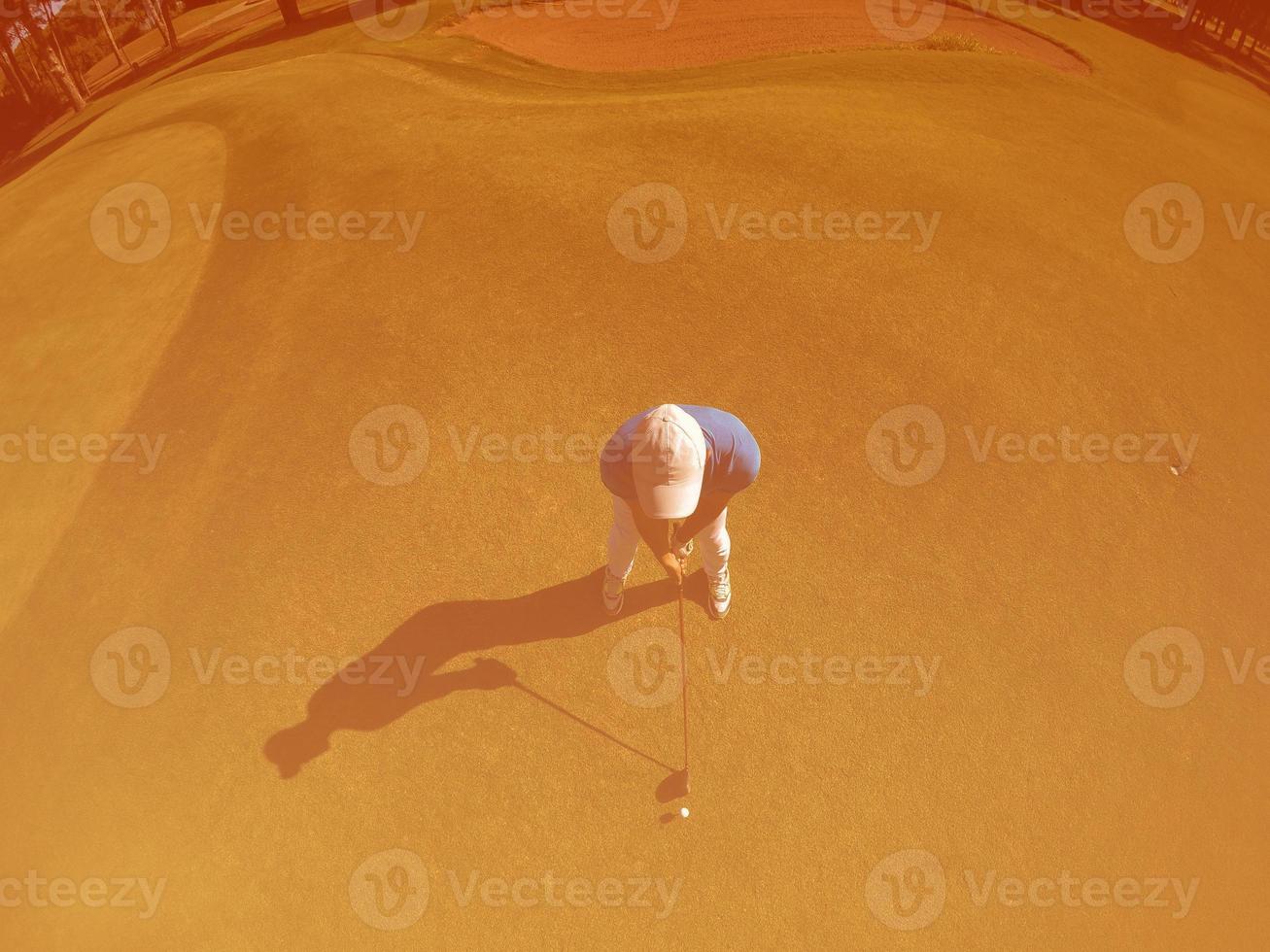 top view of golf player hitting shot photo