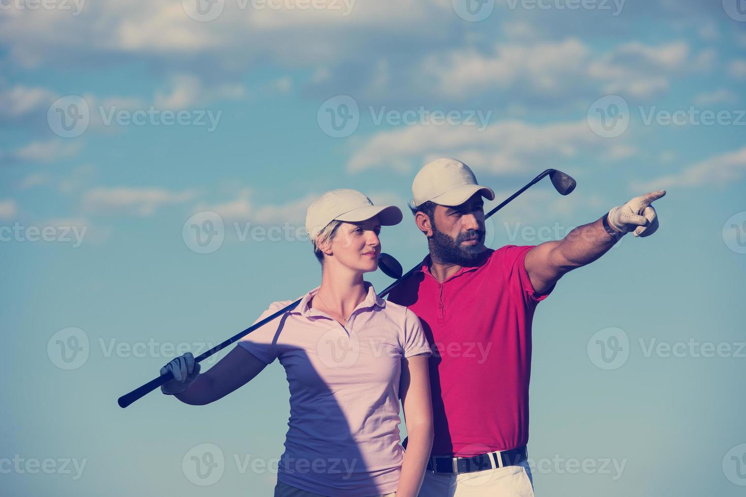 portrait of couple on golf course photo