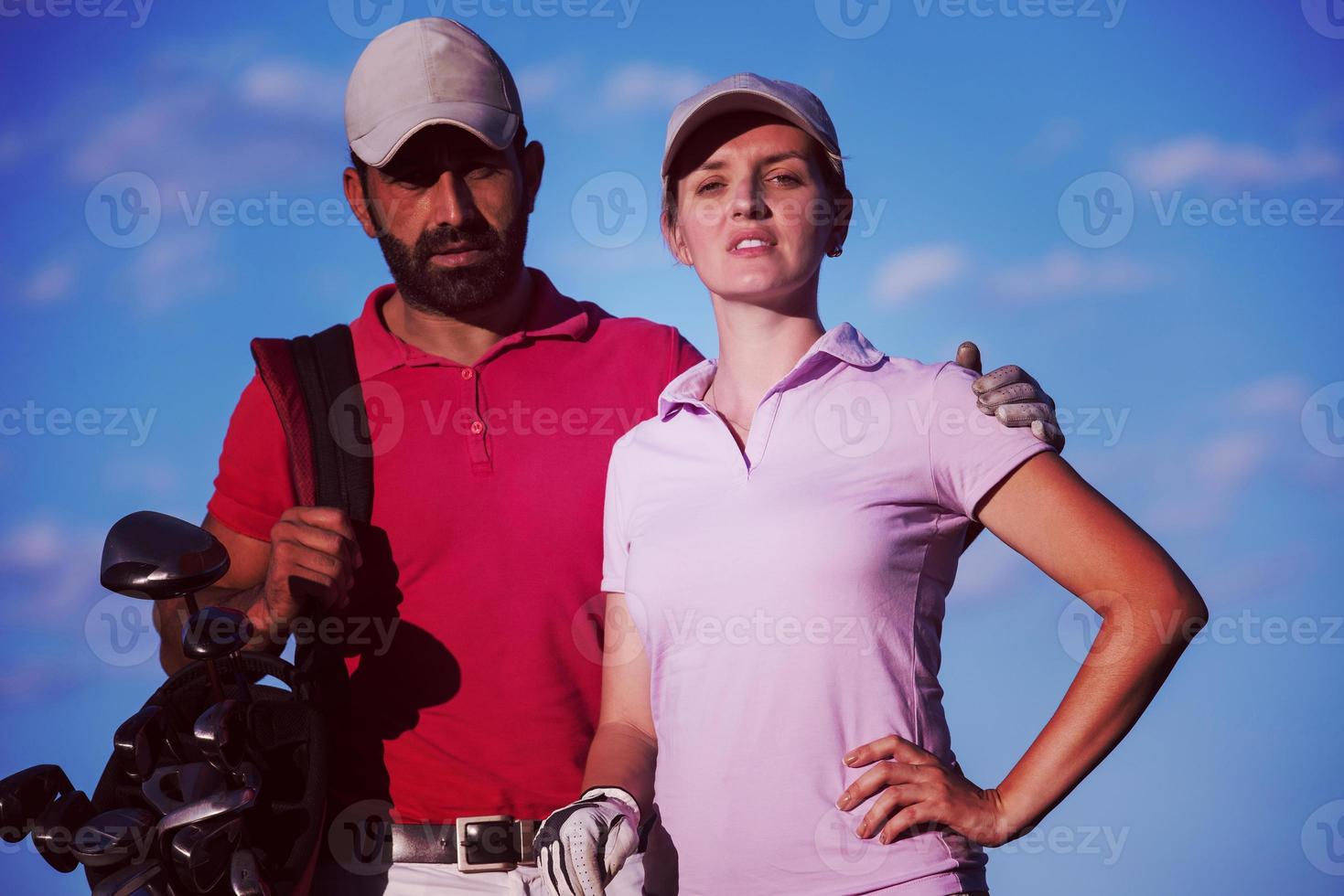 portrait of couple on golf course photo