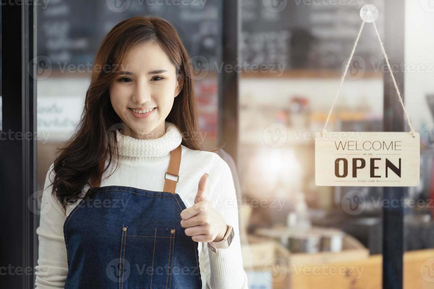 Startup stores, small business owners Standing to display a sign at the reception for customers who will come to use the service in the shop after the coronavirus situation began to unfold. photo