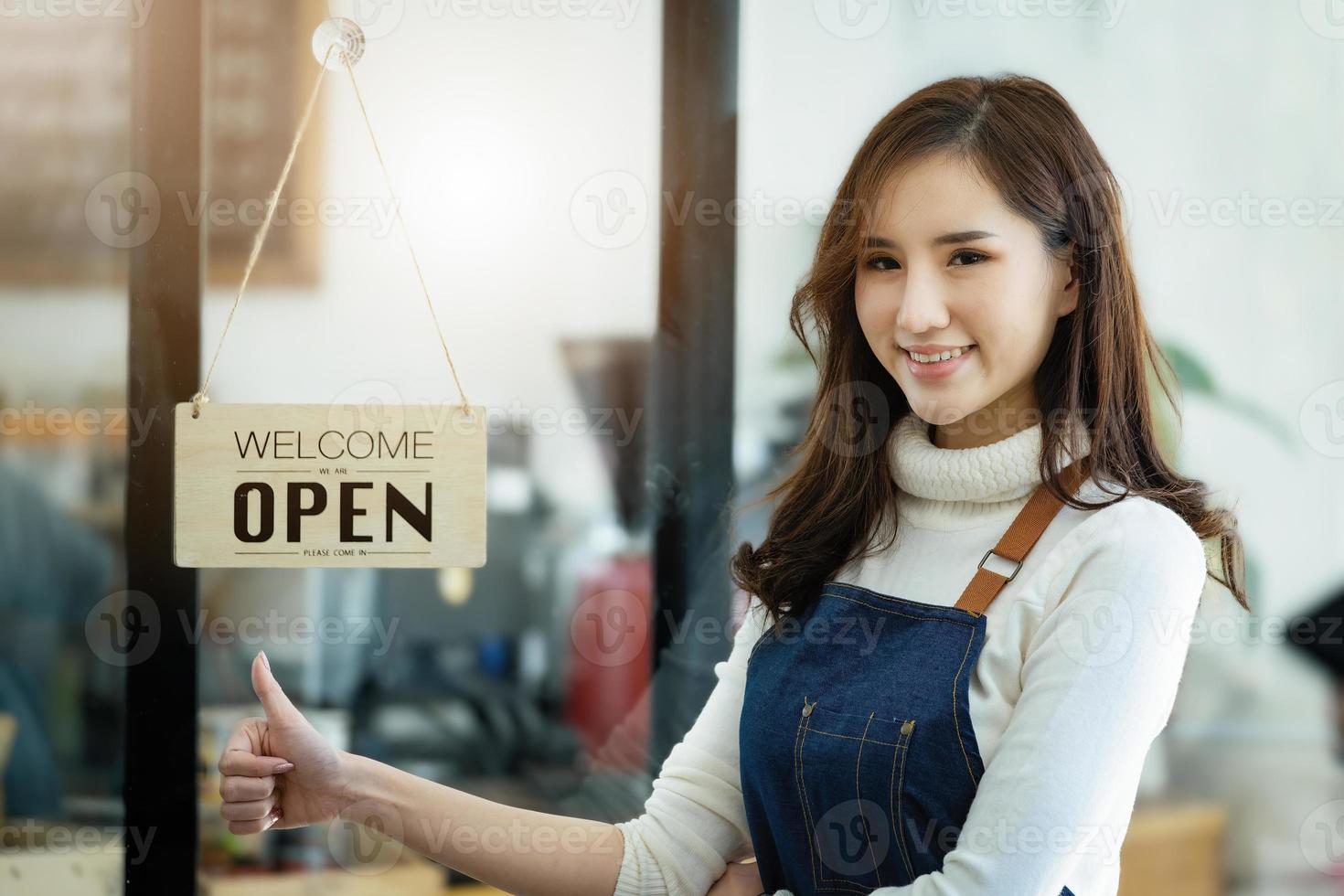 Startup stores, small business owners Standing to display a sign at the reception for customers who will come to use the service in the shop after the coronavirus situation began to unfold. photo