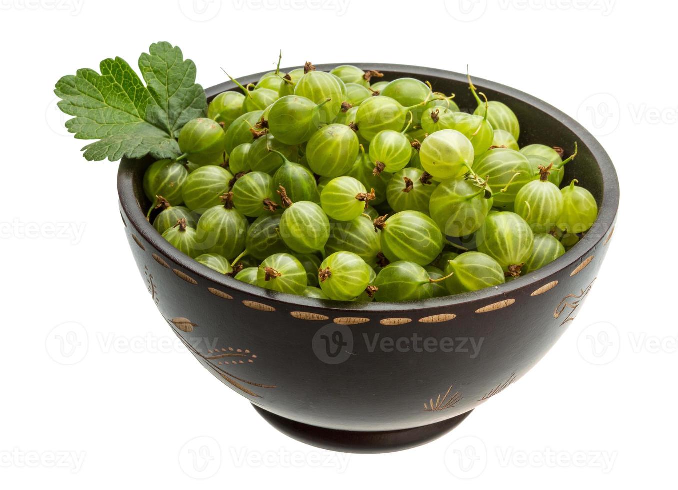 Gooseberries in a bowl on white background photo