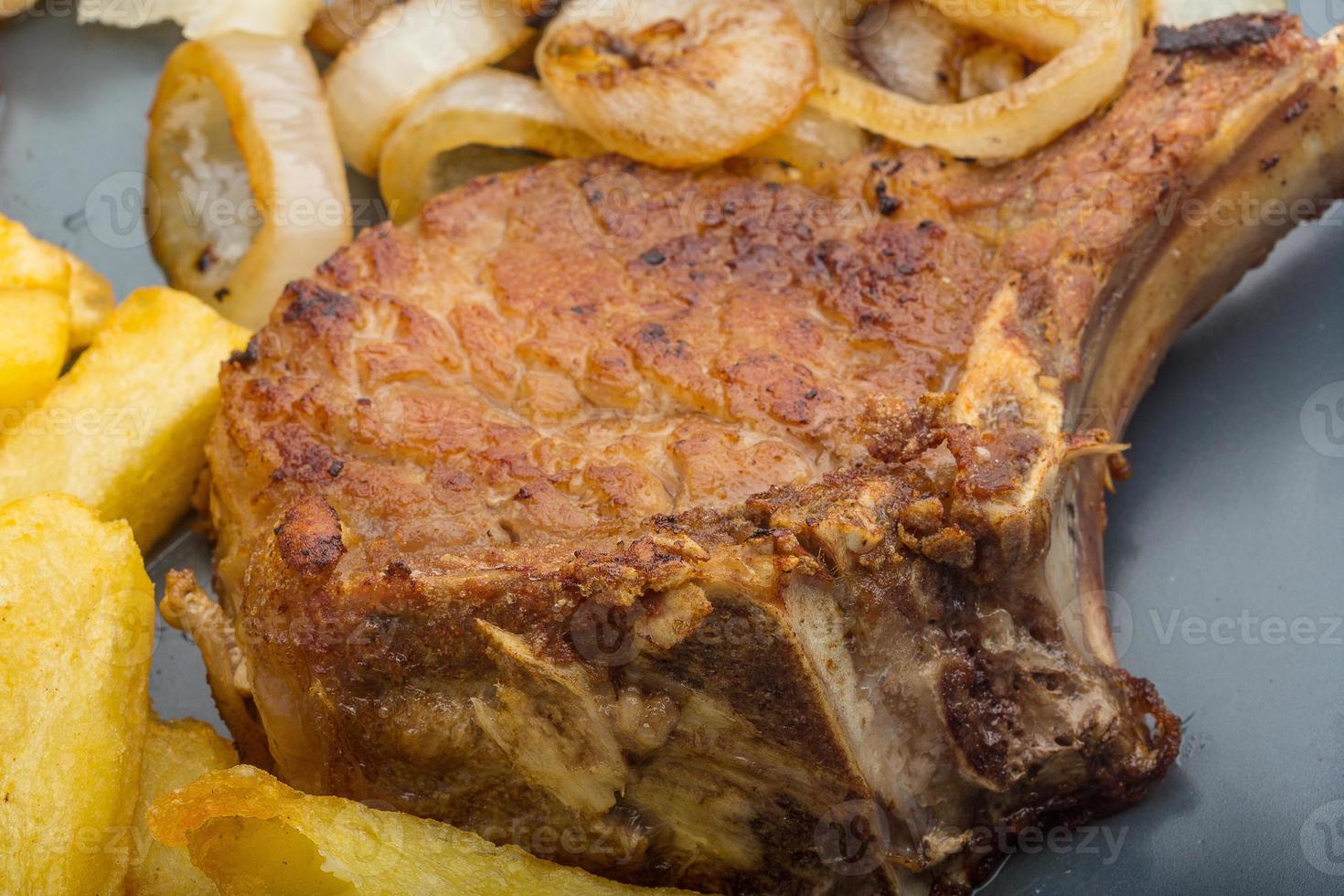 T-bone steak on the plate and white background photo