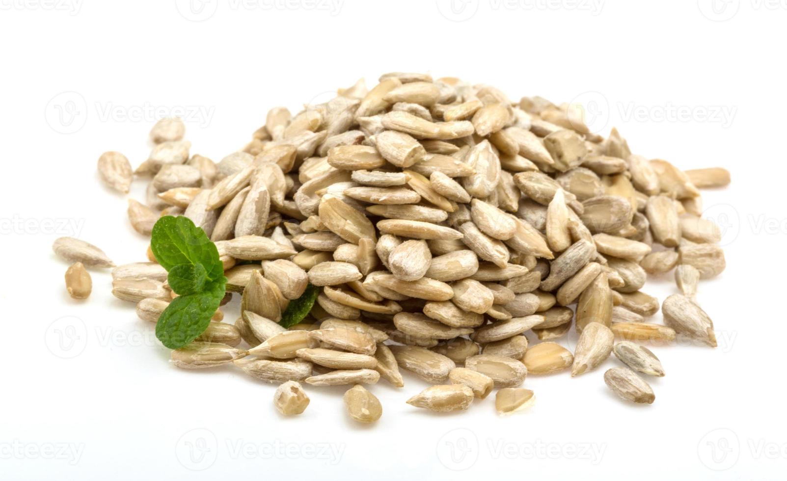 Sunflower seeds on white background photo