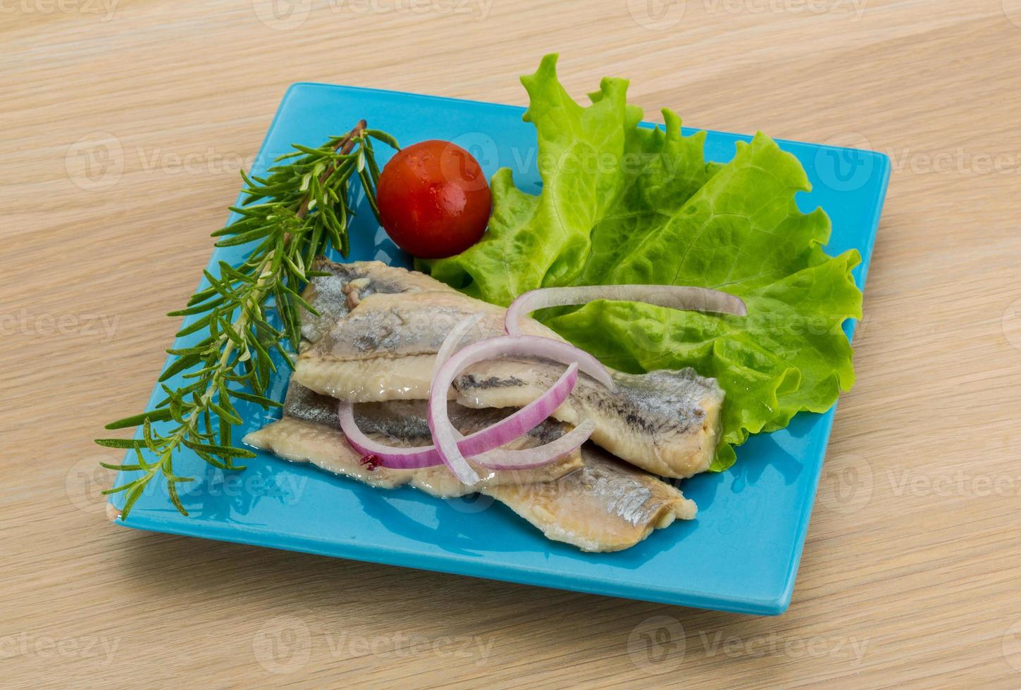 Herring fillet on the plate and wooden background 10878482 Stock Photo