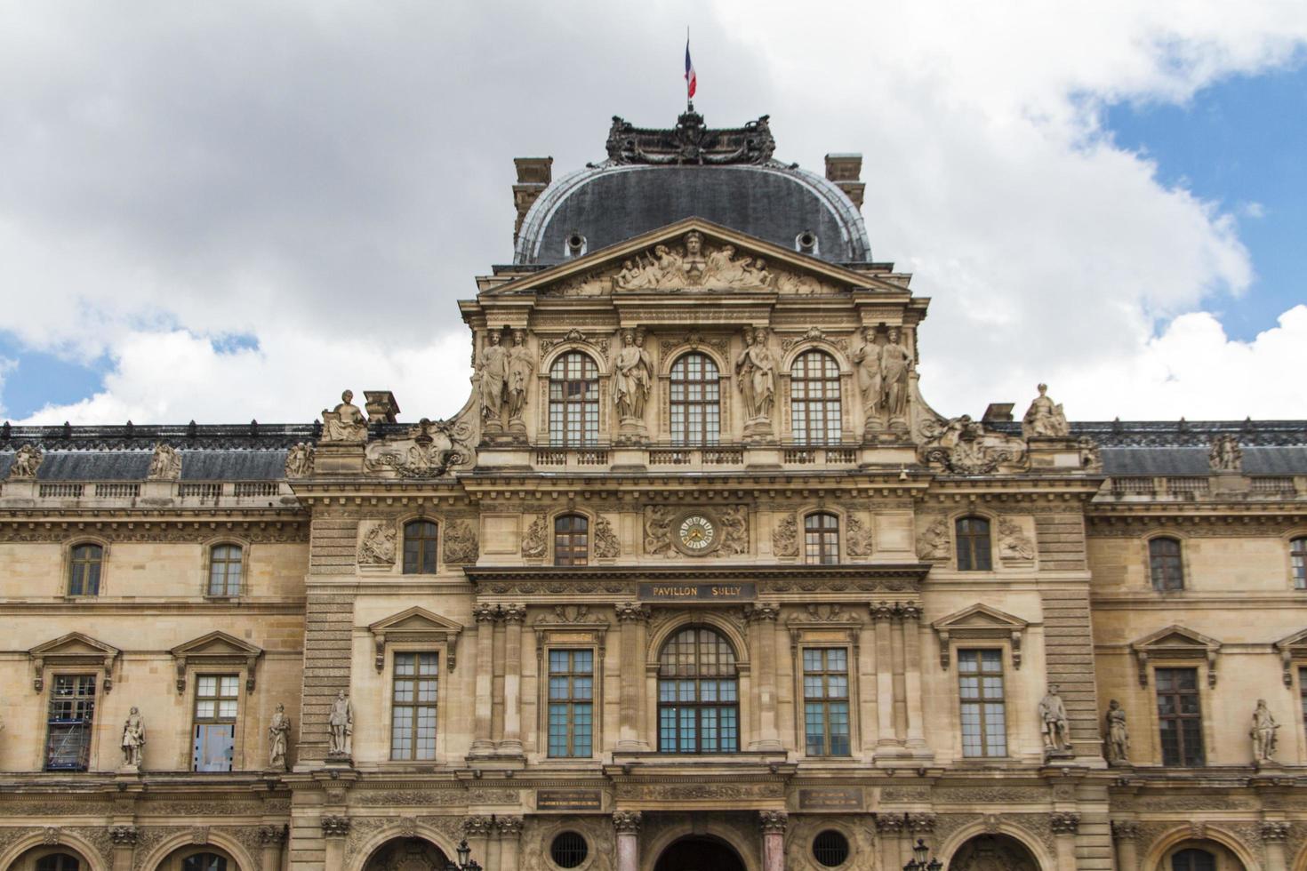 PARIS - JUNE 7 - Louvre building on June 7, 2012 in Louvre Museum, Paris, France. With 8.5m annual visitors, Louvre is consistently the most visited museum worldwide. photo