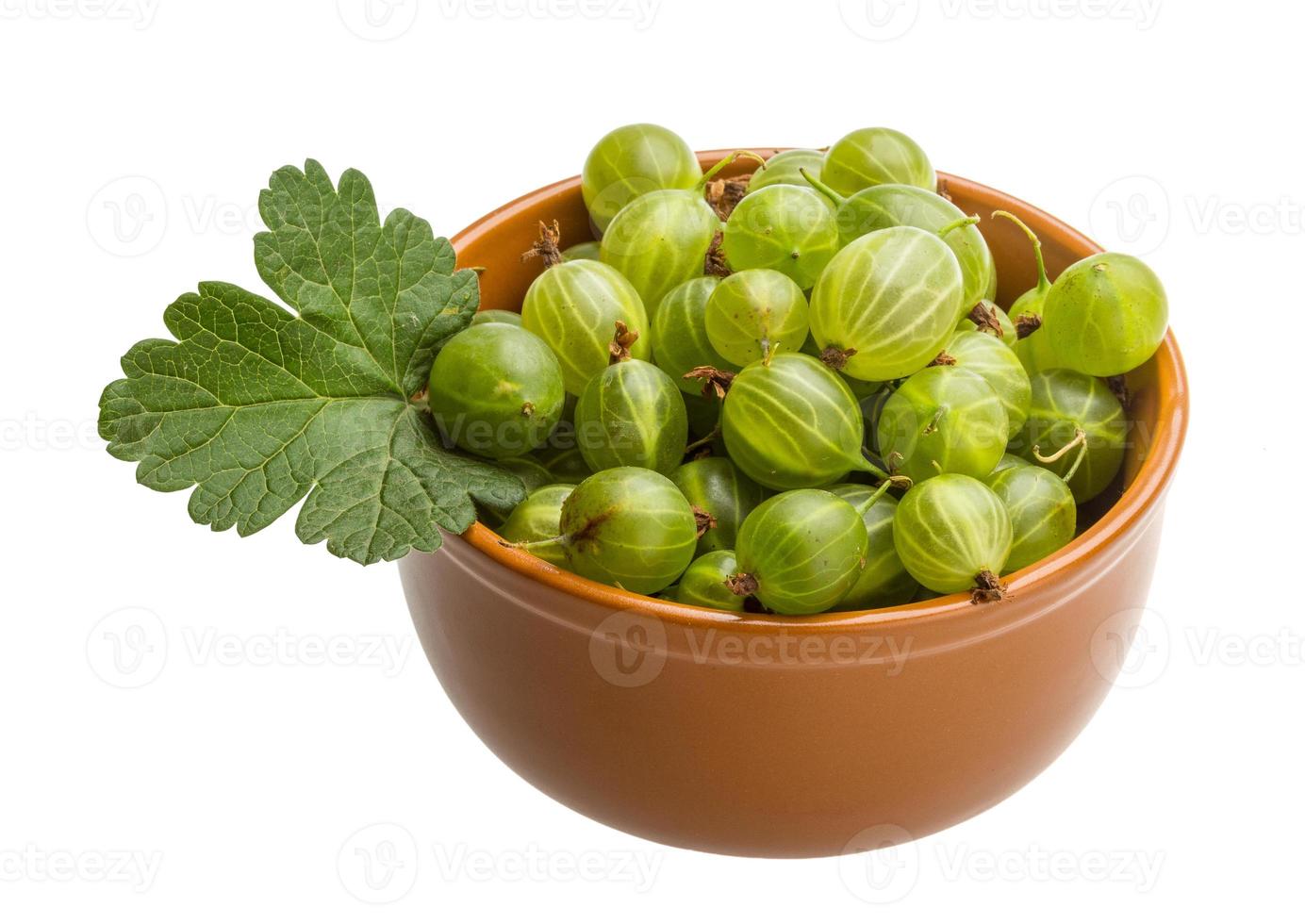 Gooseberry in a bowl on white background photo