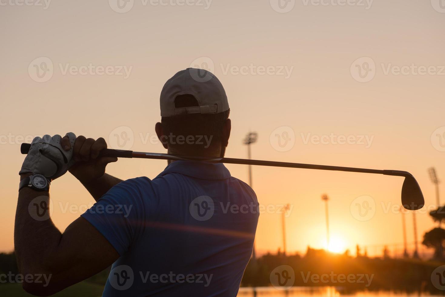 golfer hitting long shot photo